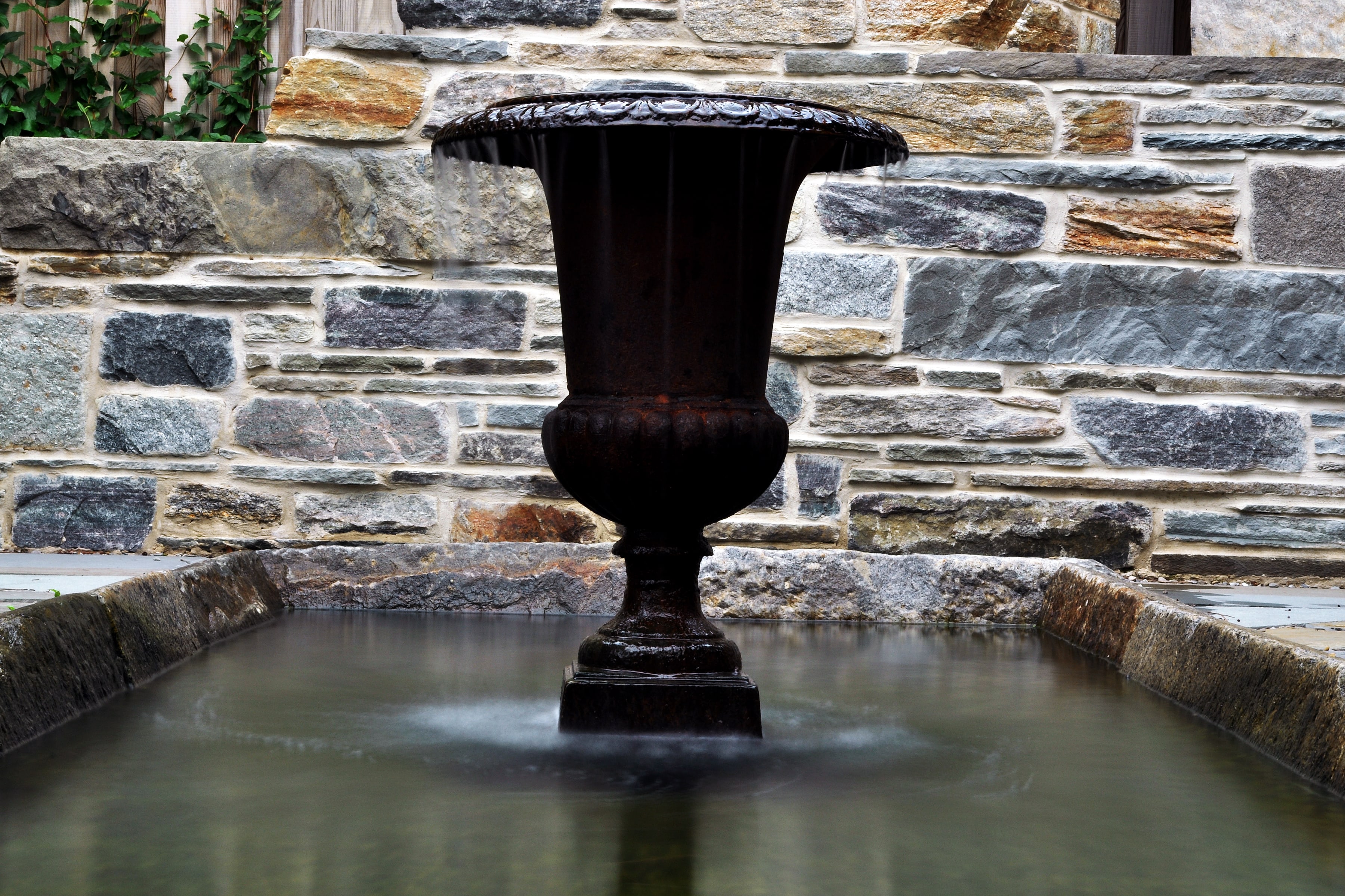 WildWorks formal stone fountain and wall