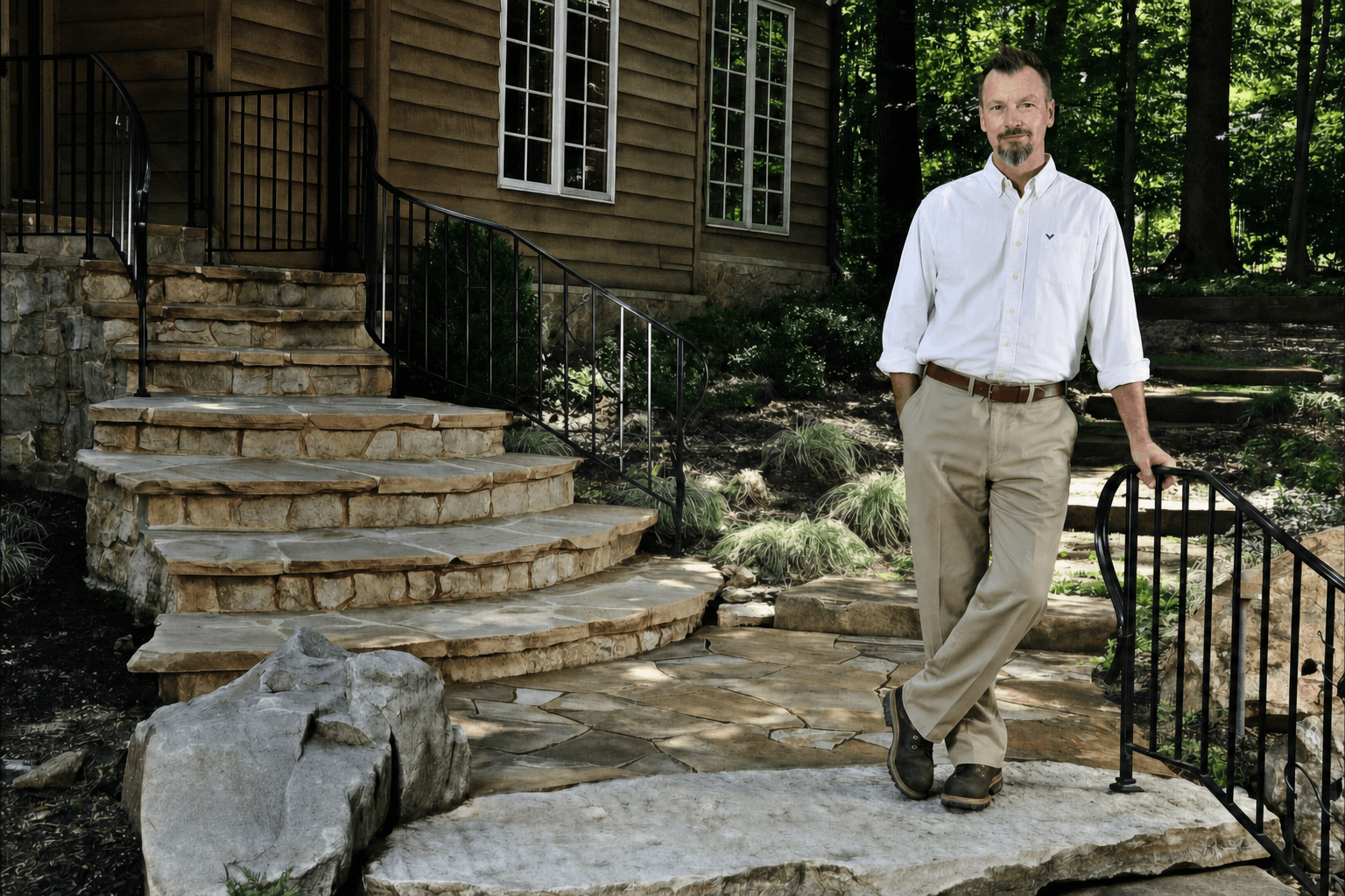 WildWorks natural stone steps and landscape with the artist standing beside the work